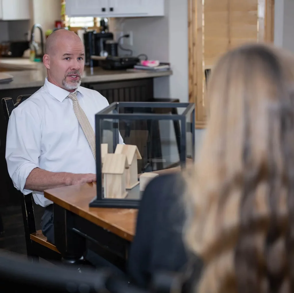 Divorce and elder law attorney conversing with a client in Utah