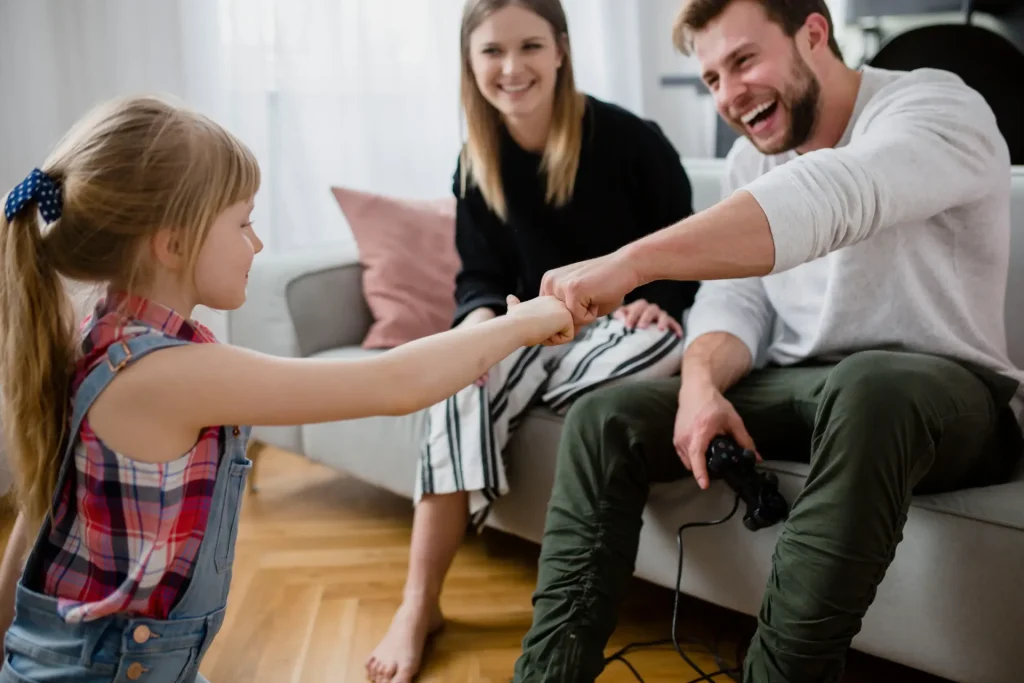 Co-parents spending quality time together with their child