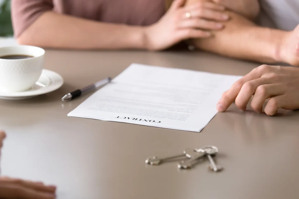 Couple reviewing prenuptial agreement documents