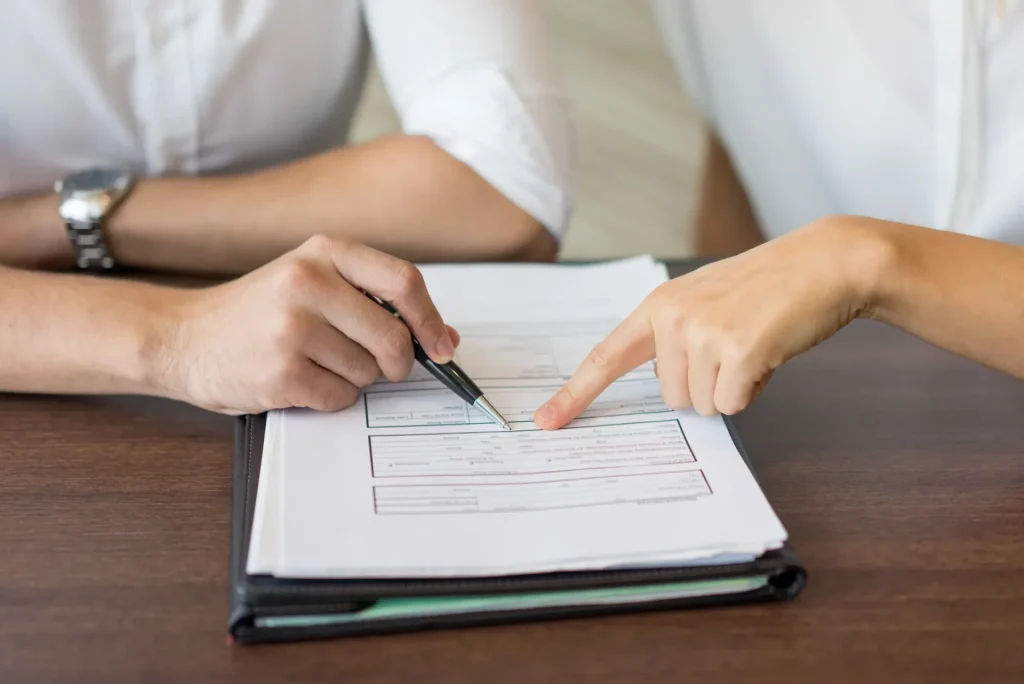 Couple reviewing prenuptial agreement terms