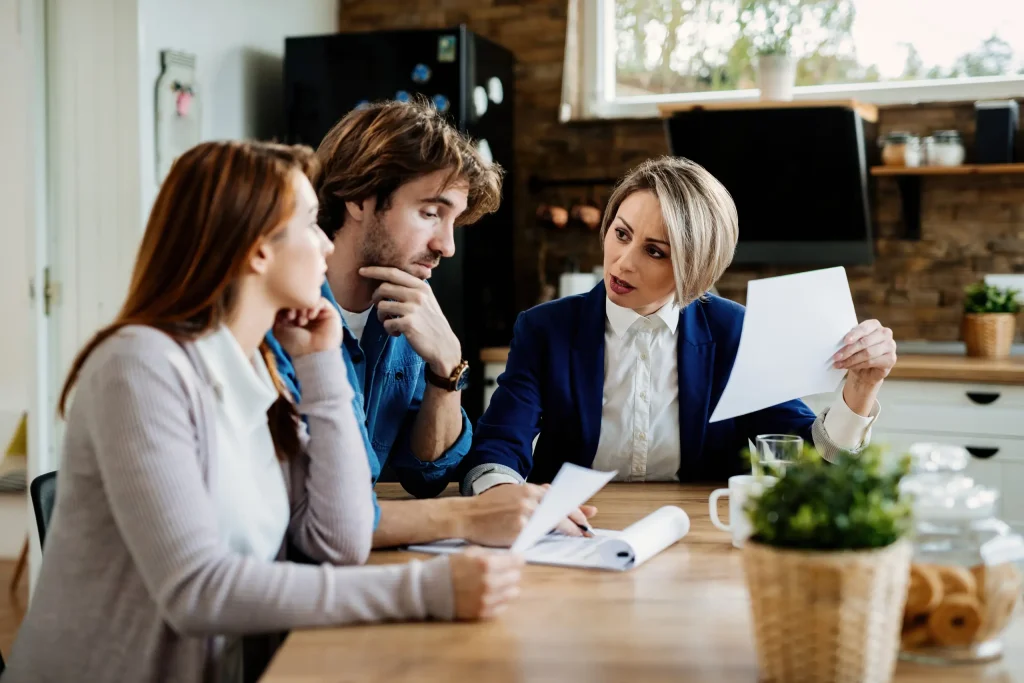 Family law attorney discussing legal documents with a couple