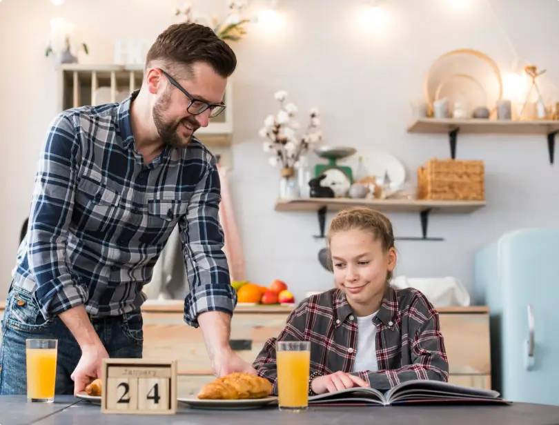 Father spending time with daughter at home