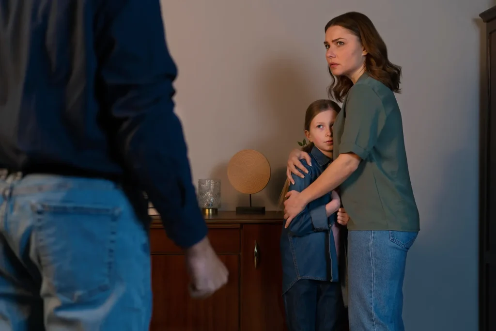 Parent protecting child during a domestic violence situation