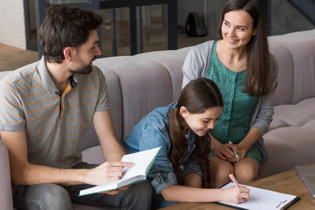 Parents reviewing a detailed parenting plan with their child