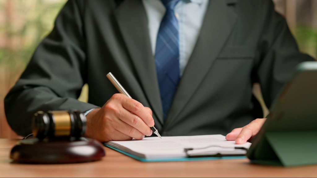 Attorney reviewing legal documents related to adult guardianship proceedings