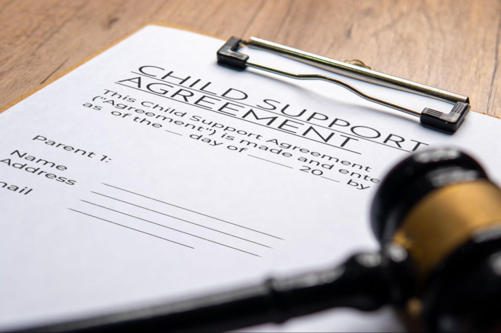 Child support agreement paperwork prepared for a legal enforcement process.