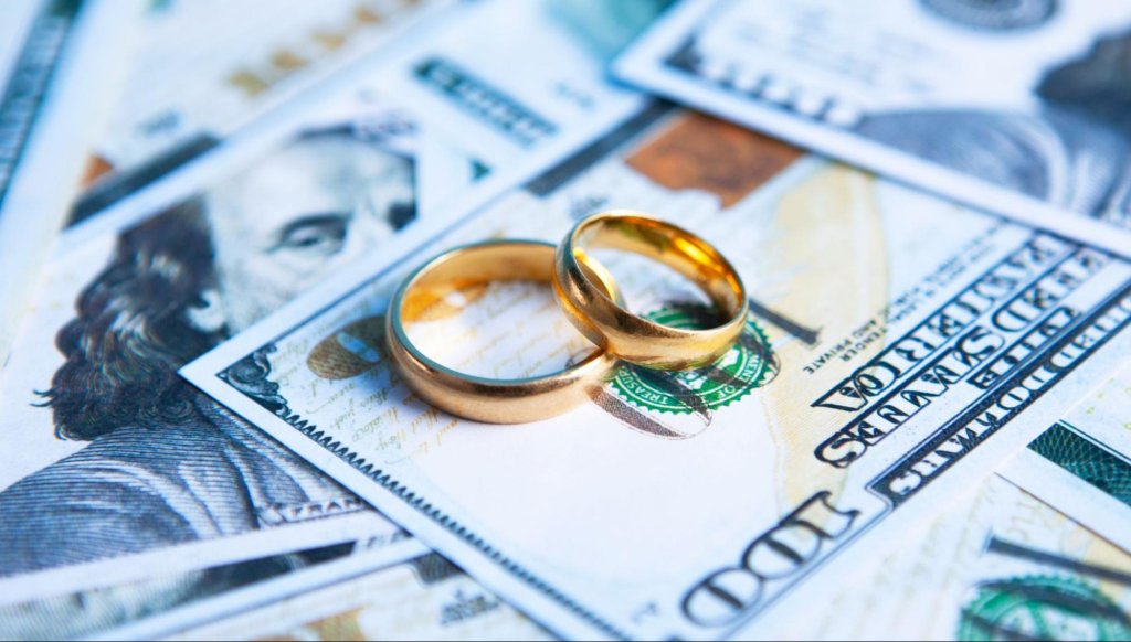 Divorce attorney reviewing legal paperwork related to property and financial settlement.